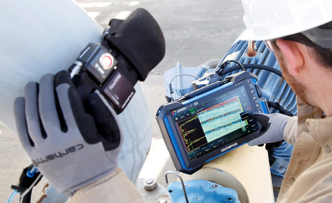 Industrial inspection specialist working with technical equipment